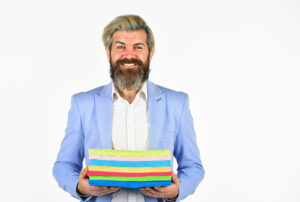 man carrying colorful handouts for managed print services for small business